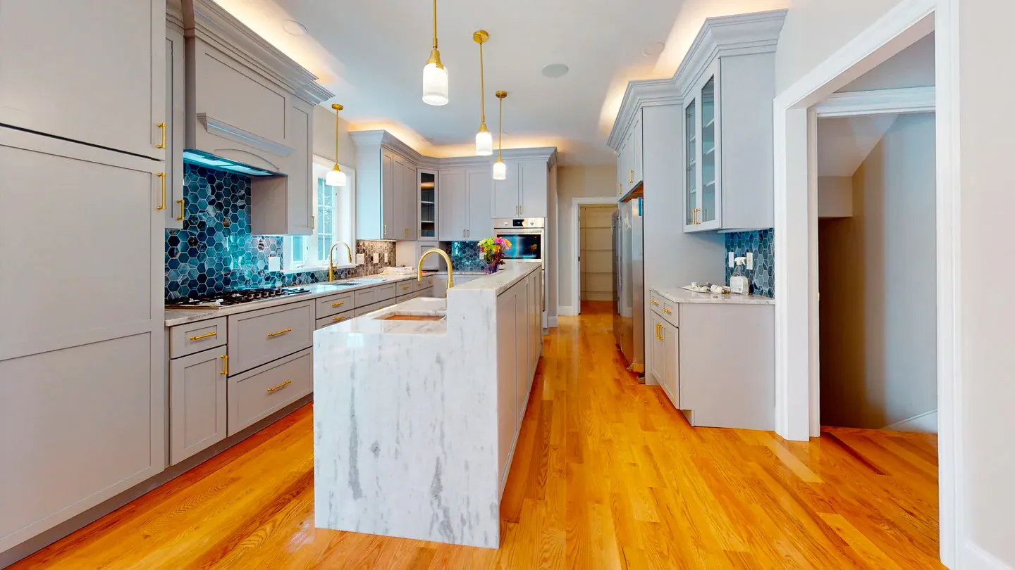 Kitchen cabinet installation with island and finished trim