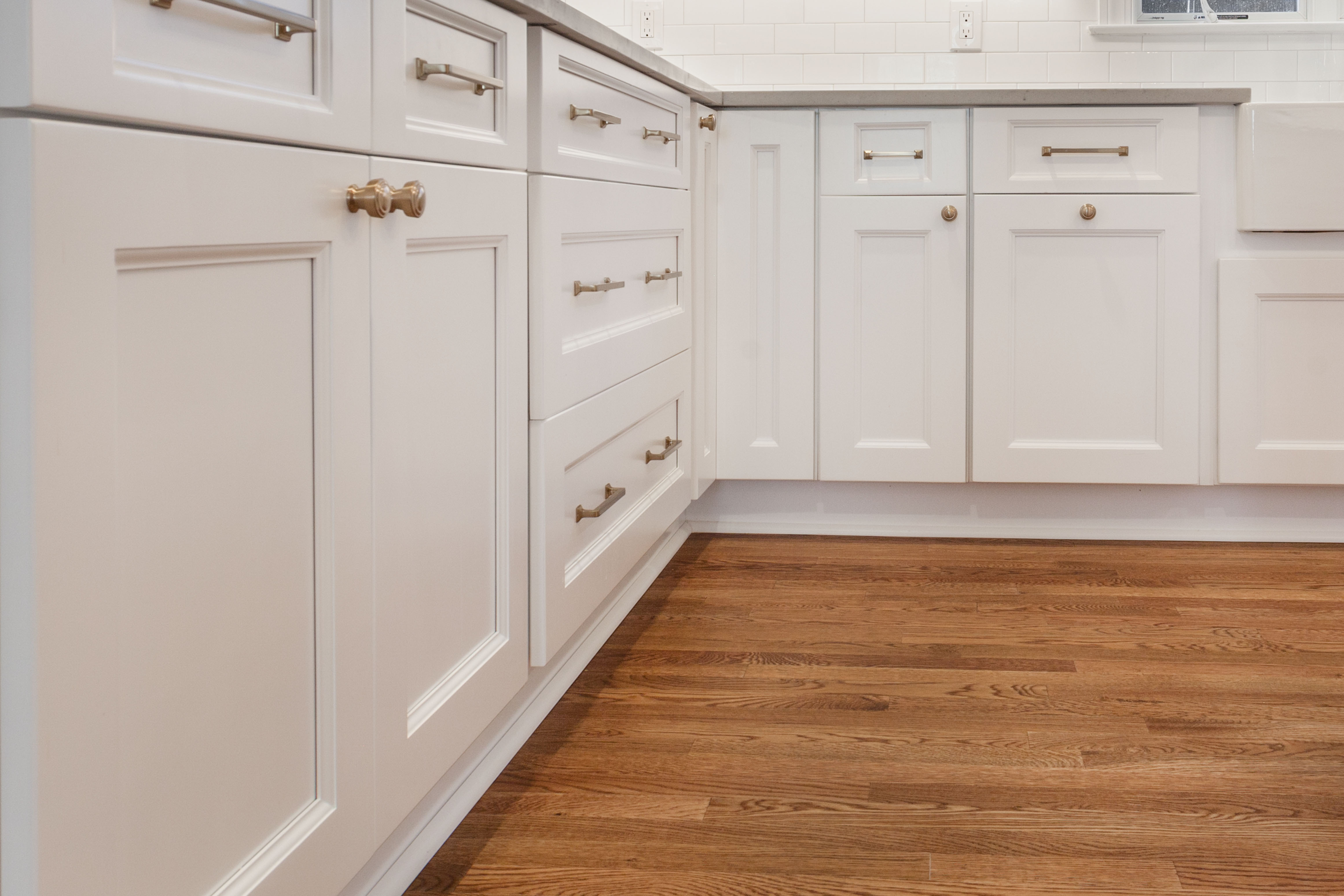 Cabinetry run set and scribed with hardware installed