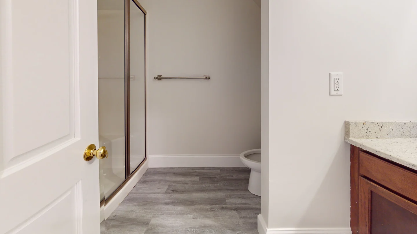 Unit bathroom with door, casing, and vanity installed