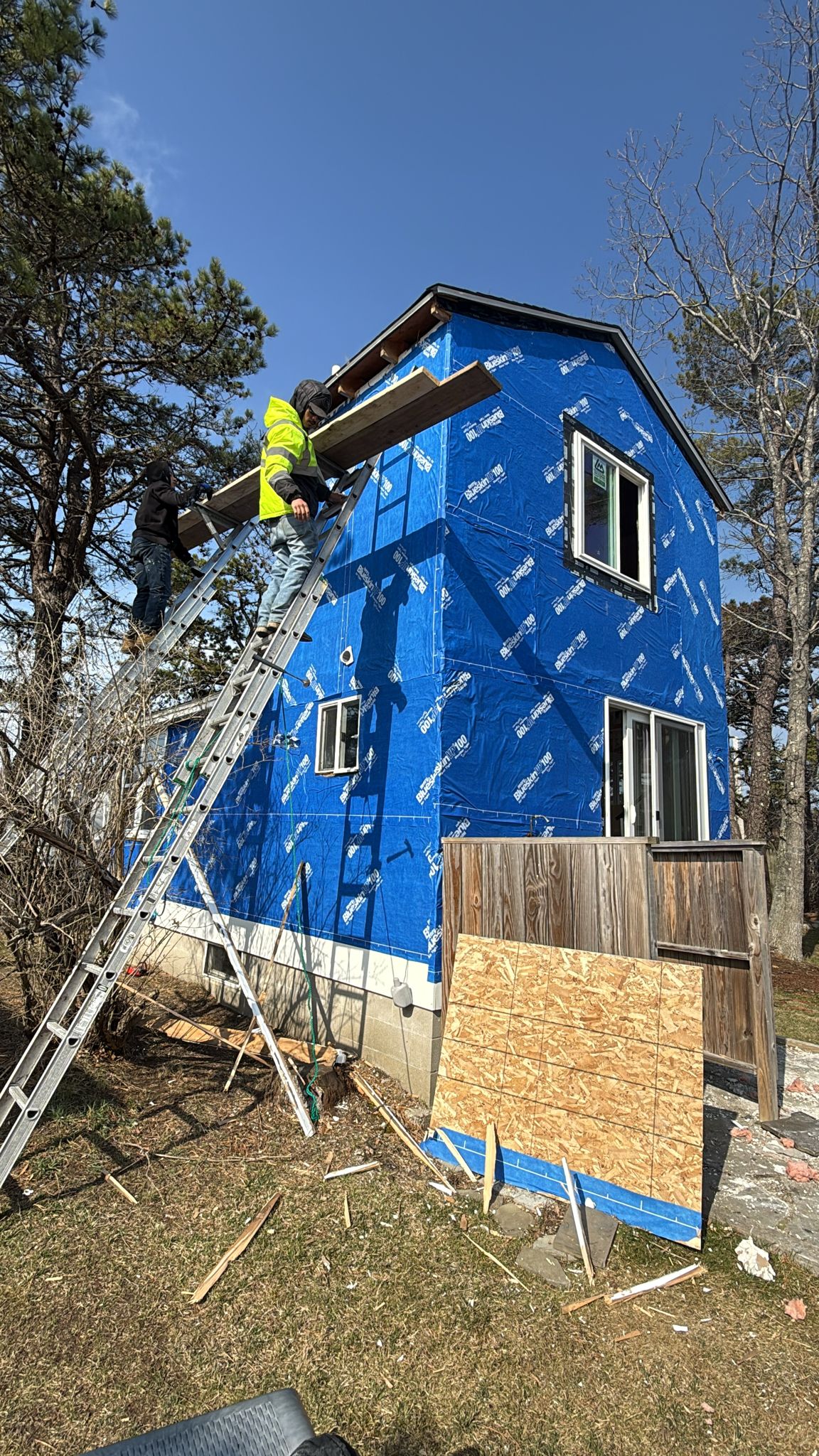 Exterior sheathing and weather barrier installed ahead of siding